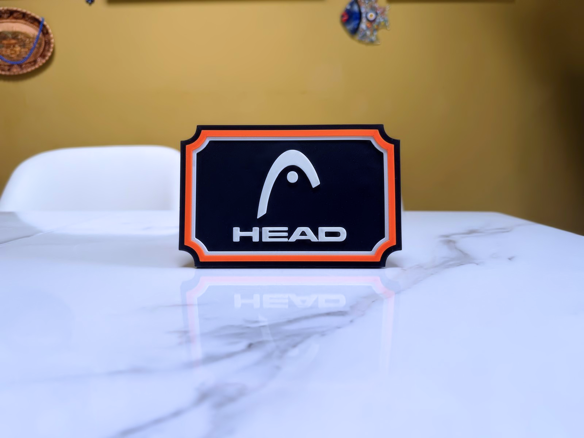 HEAD Inspired Tennis Wall Plaque, Black White & Orange, 17cm