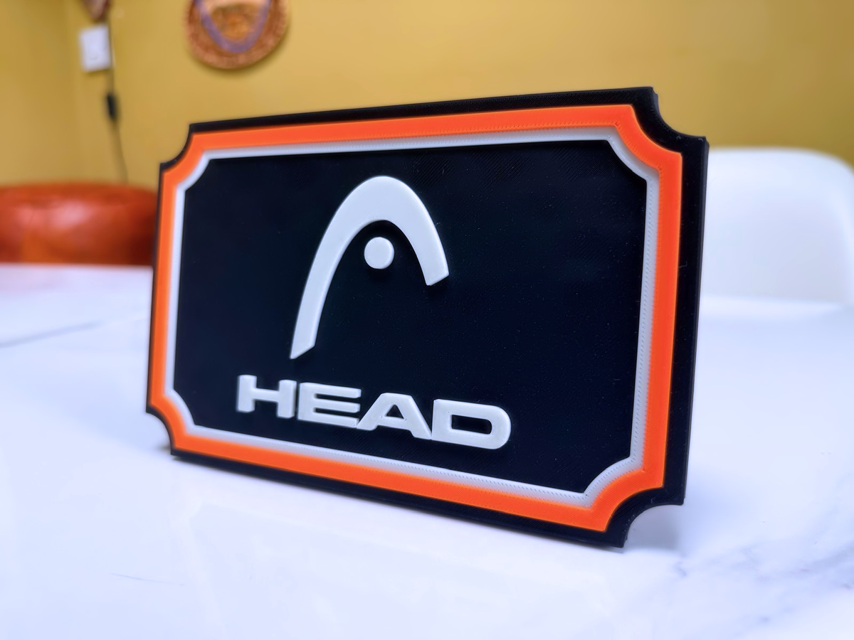 HEAD Inspired Tennis Wall Plaque, Black White & Orange, 17cm