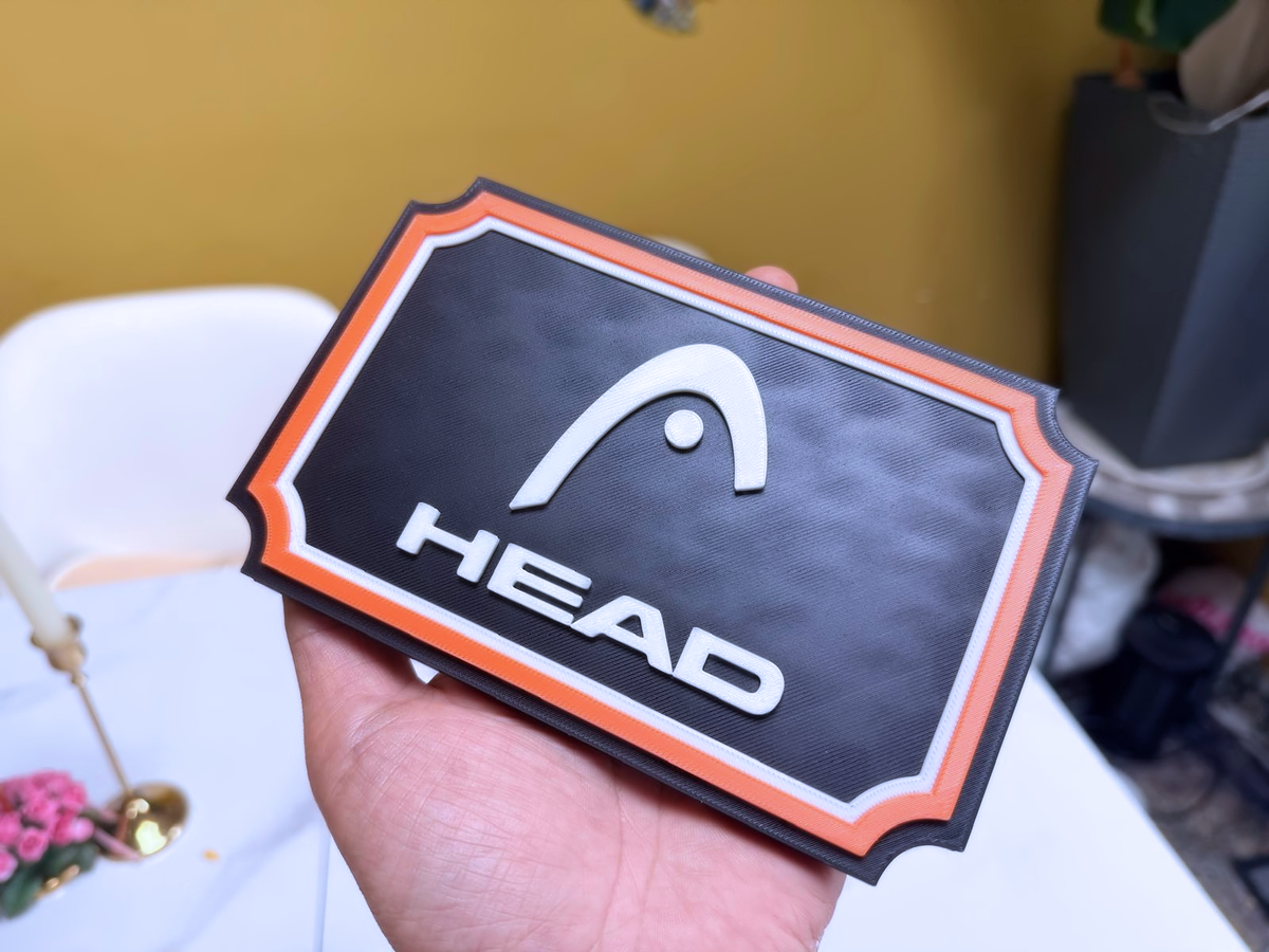 HEAD Inspired Tennis Wall Plaque, Black White & Orange, 17cm